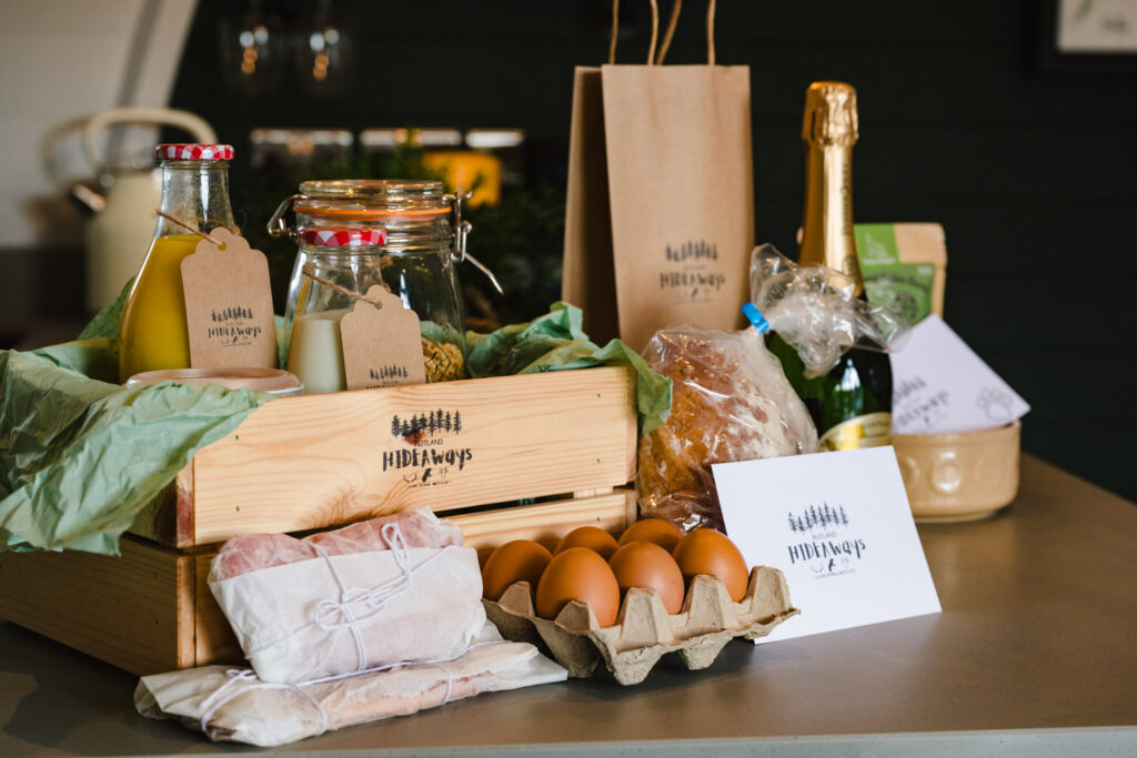 Artisan breakfast hamper styling in a modern lodge kitchen for luxury hospitality marketing.