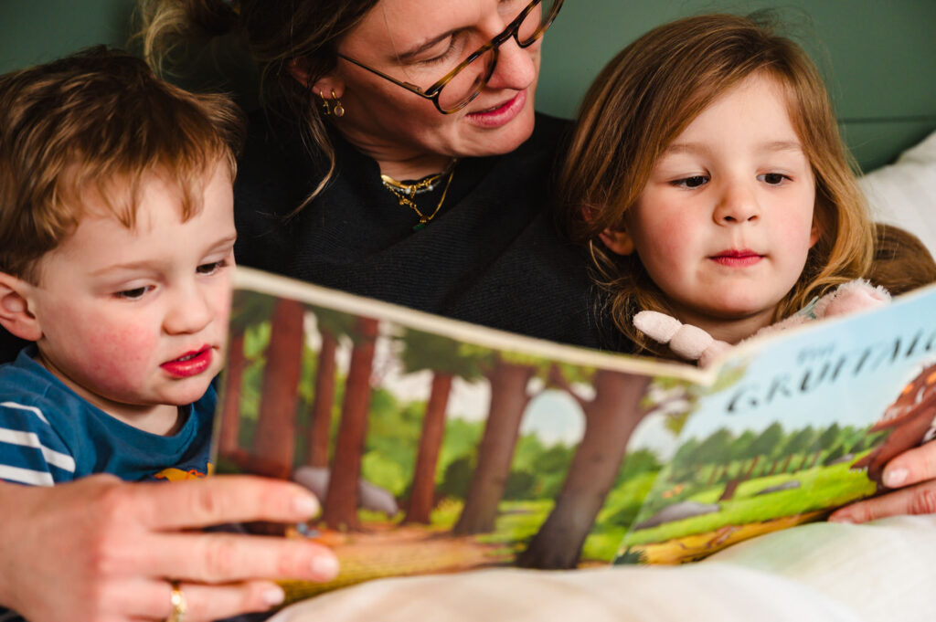 Authentic lifestyle photography of a family relaxing in a luxury hotel suite or holiday lodge