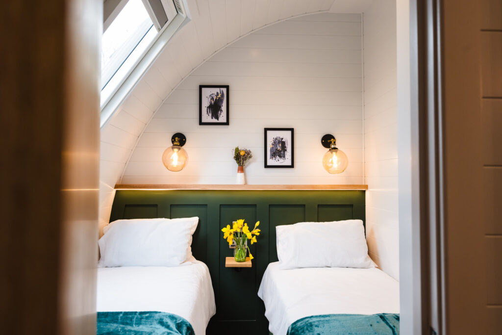 Open-plan interior photography showing a bedroom of a luxury holiday lodge in Rutland featuring modern Scandinavian design