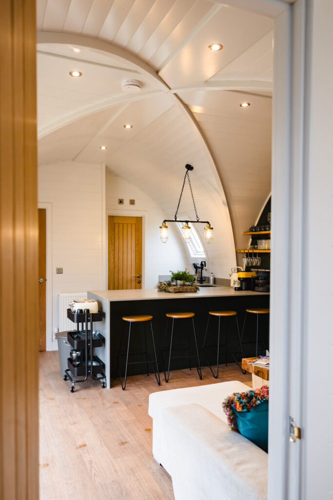 Open-plan interior photography of a luxury holiday lodge in Rutland featuring modern Scandinavian design