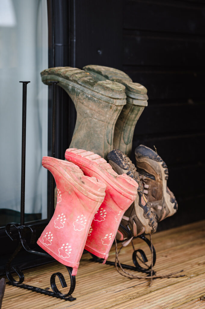 Authentic country living lifestyle shot of welly boots at a luxury lodge in the East Midlands