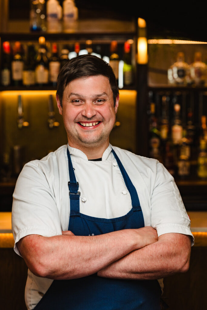 Professional portrait of a head chef in a high-end East Midlands restaurant