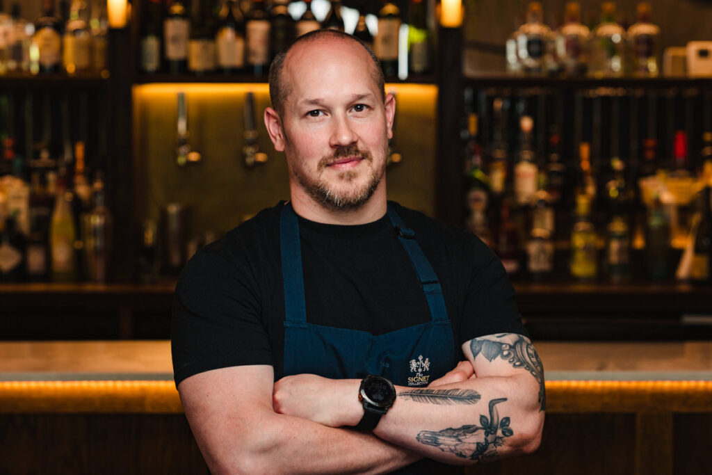 Friendly professional headshot of a hospitality chef for website 'About' page.